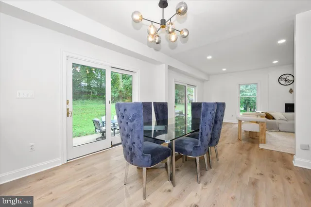 a kitchen with a sink a counter top space stainless steel appliances and cabinets