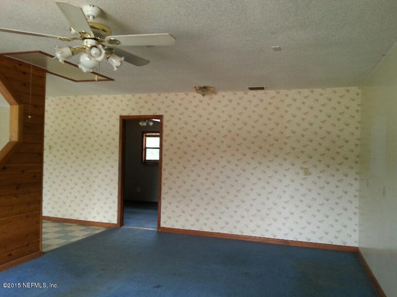 243 Dusty Road St. Augustine, FL 32095 - Photo 2 of 25 a view of an empty room with a chandelier fan