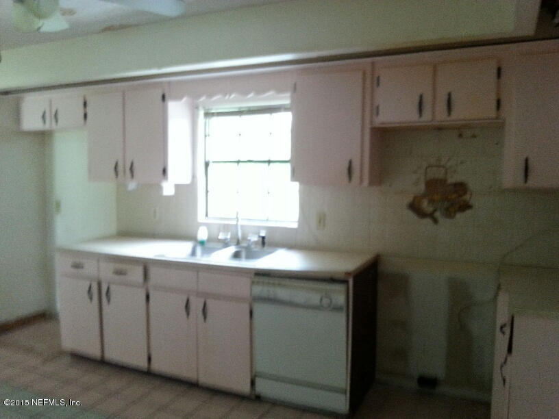 243 Dusty Road St. Augustine, FL 32095 - Photo 7 of 25 a bathroom with a double vanity sink and mirror