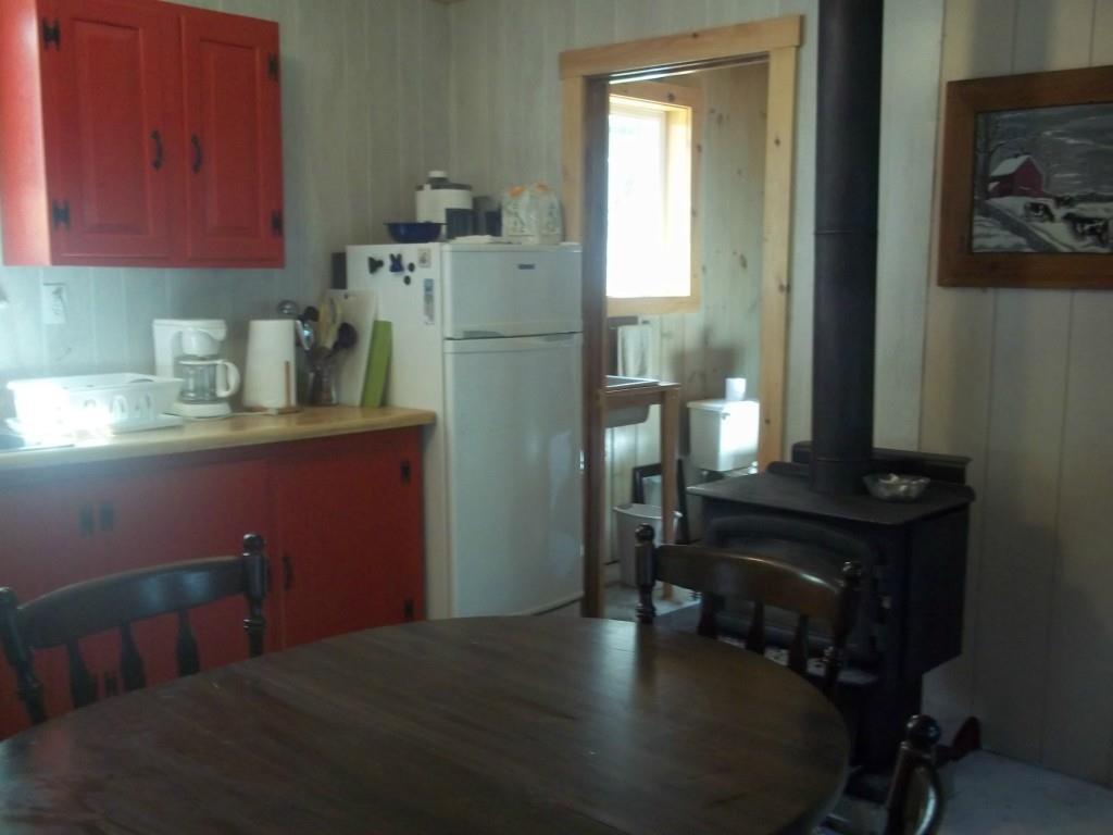 254 Cemetery Road Whiting, ME 04691 - Photo 23 of 35 An air tight wood stove takes the...