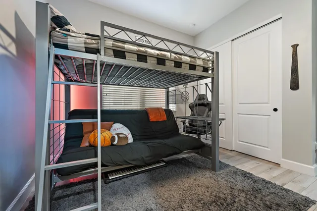 a bathroom with a granite countertop sink a toilet and shower