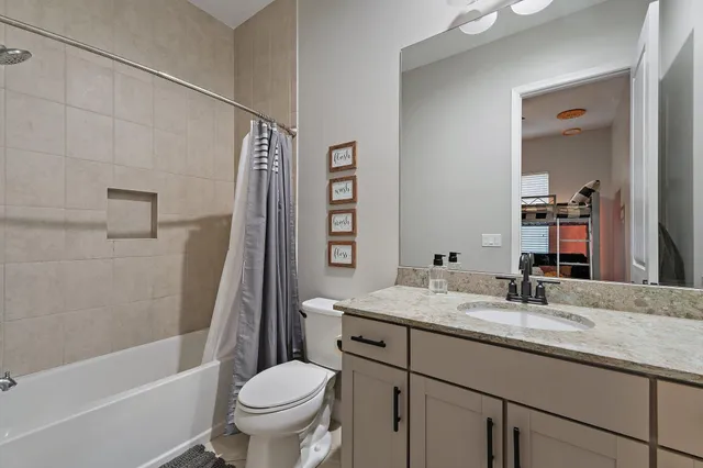 a bed room with a bed and a chandelier