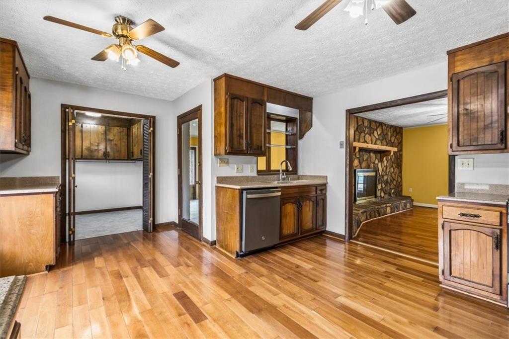 202 Ridgewood Road Cedartown, GA 30125 - Photo 21 of 45 a view of a kitchen with a sink dishwasher stove top oven and cabinets
