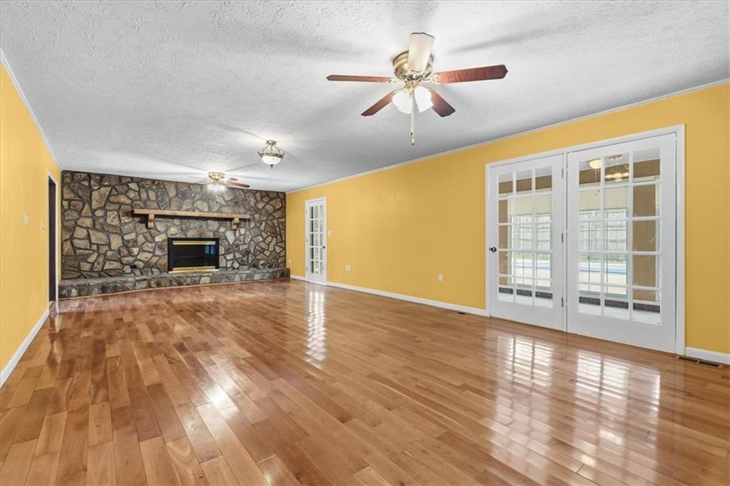 202 Ridgewood Road Cedartown, GA 30125 - Photo 23 of 45 a view of empty room with wooden floor and fireplace