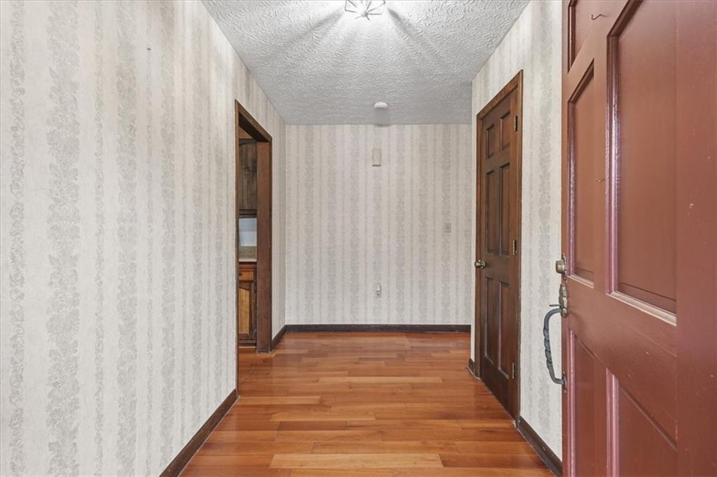 202 Ridgewood Road Cedartown, GA 30125 - Photo 26 of 45 a view of a hallway with wooden floor