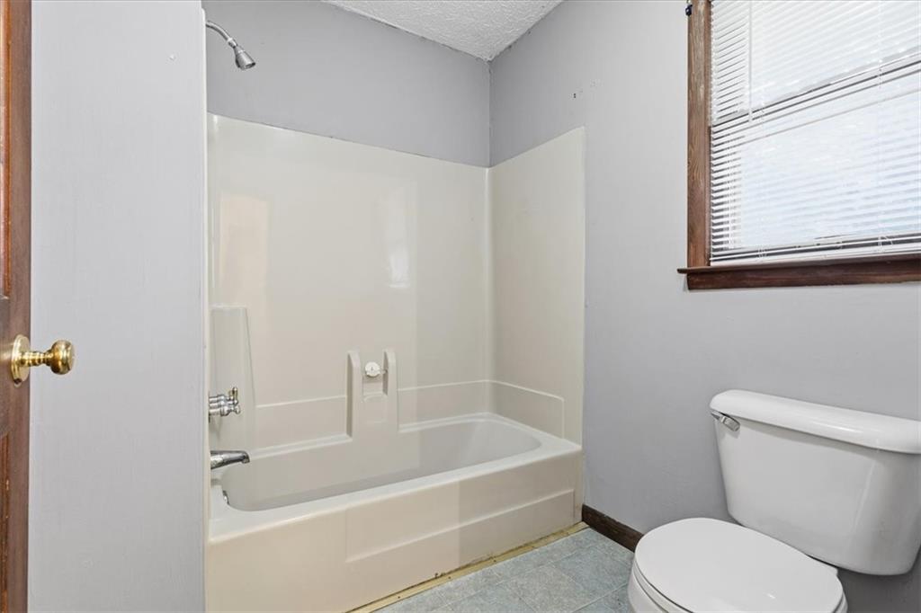202 Ridgewood Road Cedartown, GA 30125 - Photo 34 of 45 a white bath tub sitting next to a white toilet
