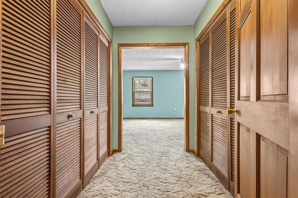 202 Ridgewood Road Cedartown, GA 30125 - Photo 35 of 45 a view of a hallway with wooden floor and staircase
