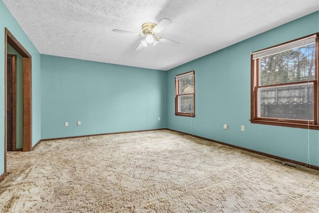 202 Ridgewood Road Cedartown, GA 30125 - Photo 37 of 45 a view of an empty room with windows