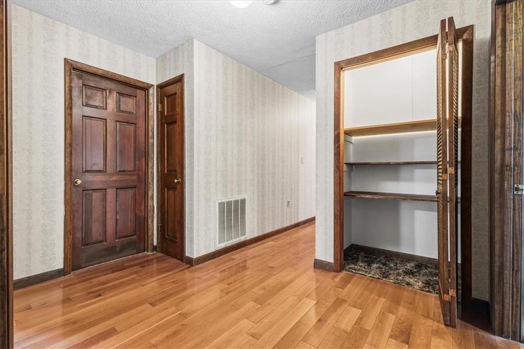 202 Ridgewood Road Cedartown, GA 30125 - Photo 40 of 45 a view of an empty room with wooden floor and a window