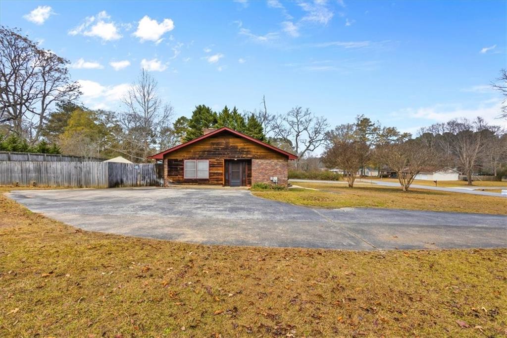 202 Ridgewood Road Cedartown, GA 30125 - Photo 7 of 45 a front view of a house with a yard and trees