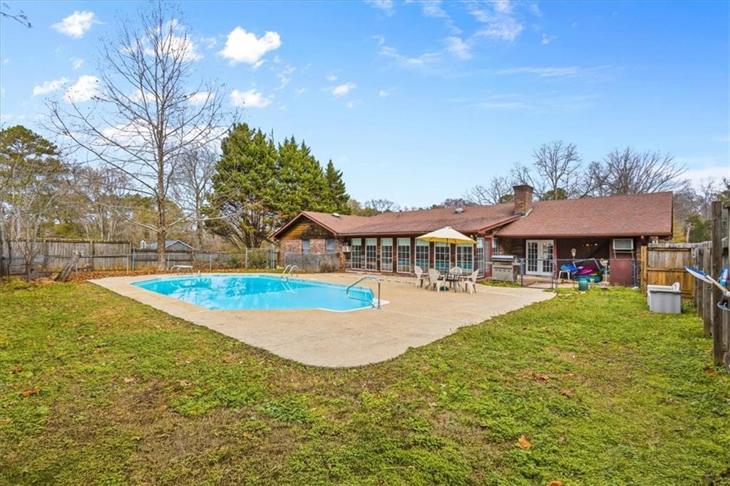 202 Ridgewood Road Cedartown, GA 30125 - Photo 8 of 45 a view of a house with swimming pool and a yard