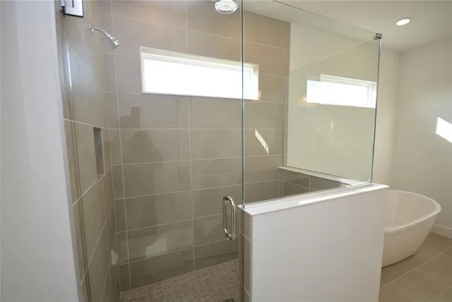 a bathroom with a shower and a sink