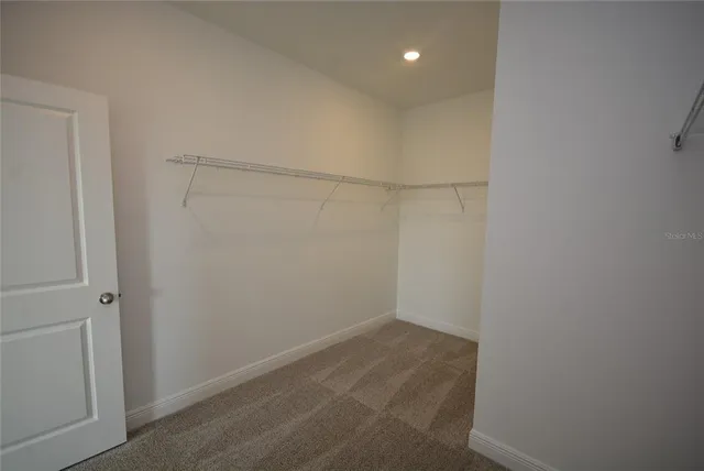 a view of a room with racks on the wall