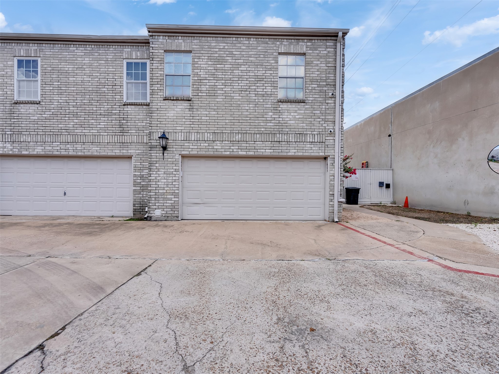 4001 Tanglewilde Street, Unit 605 Houston, TX 77063 - Photo 2 of 29 a front view of a house with a yard