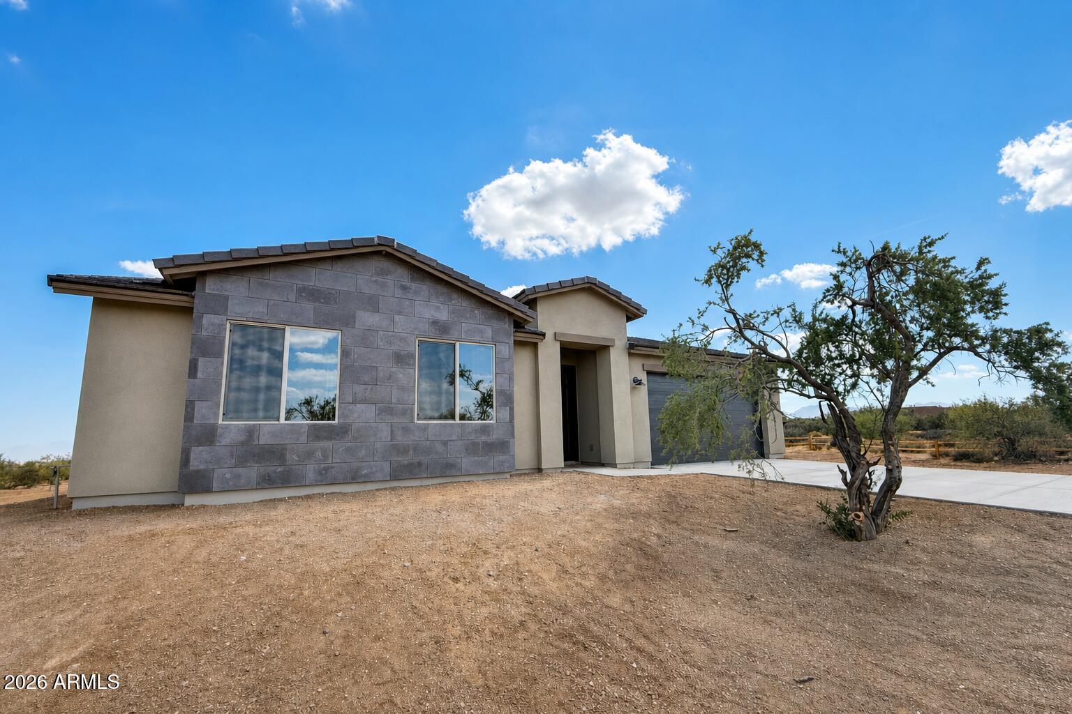 16957 East Bobwhite Way Rio Verde, AZ 85263 - Photo 1 of 25 a view of a house with a backyard and a tree