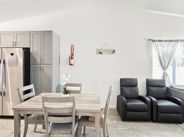 a work place with furniture and a window