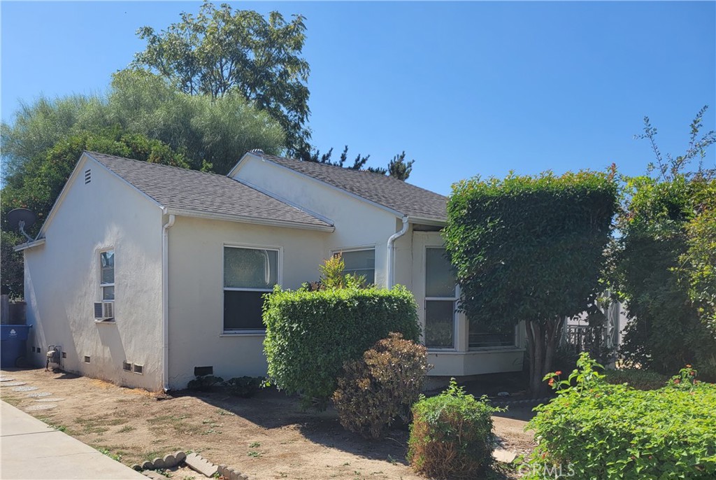 17638 Welby Way Lake Balboa, CA 91406 - Photo 1 of 3 a front view of a house with a yard