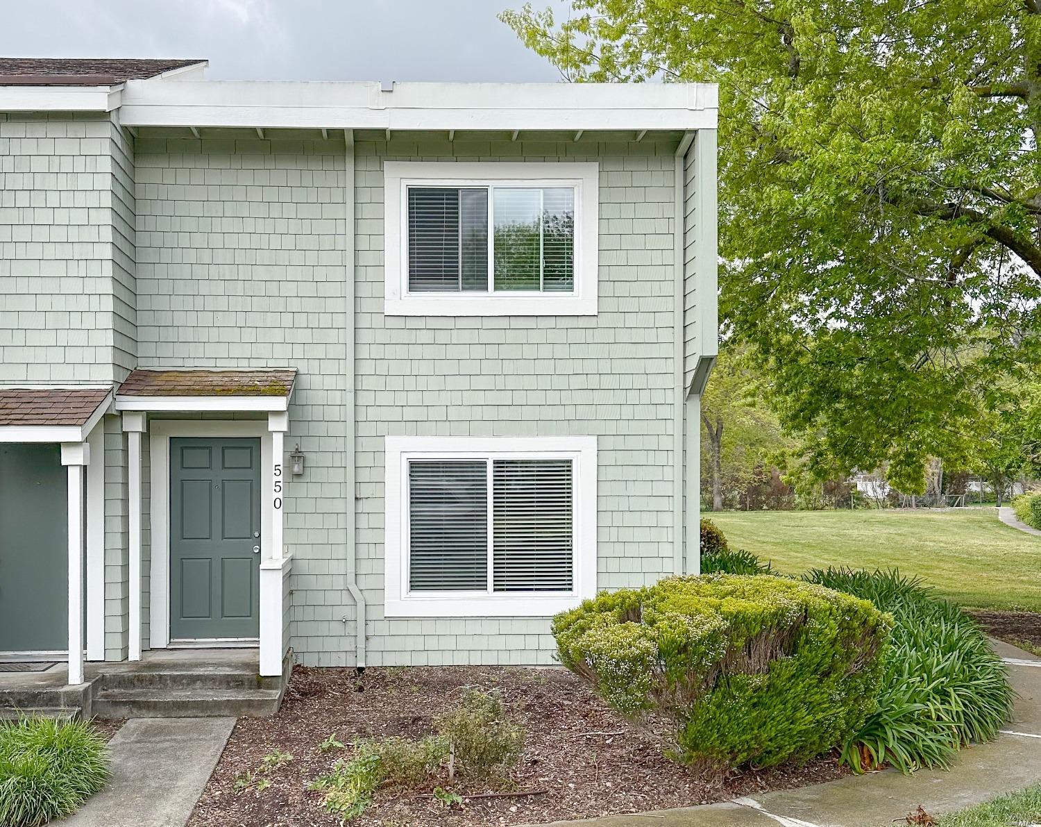 a front view of a house with garden