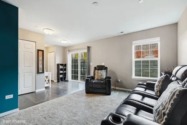 a living room with furniture and a large window