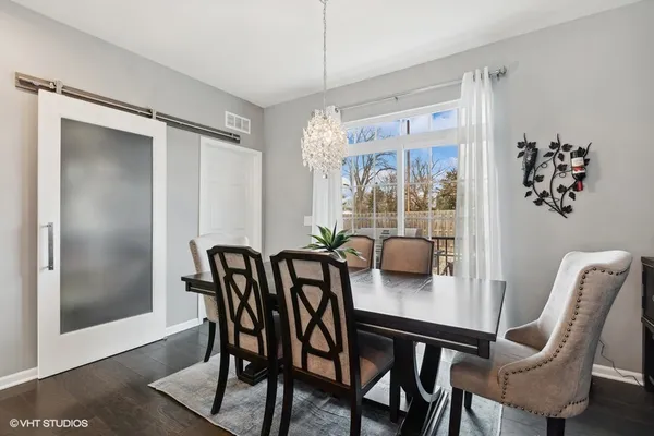 a view of a dining room with furniture window and outside view