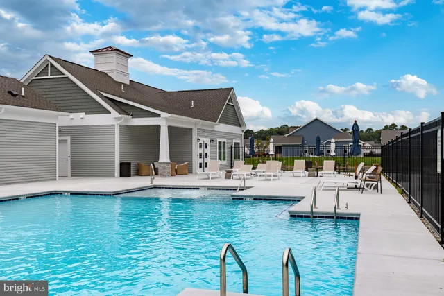 a view of house with swimming pool yard patio and outdoor seating