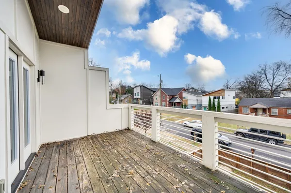 a view of kitchen with stainless steel appliances and cabinets