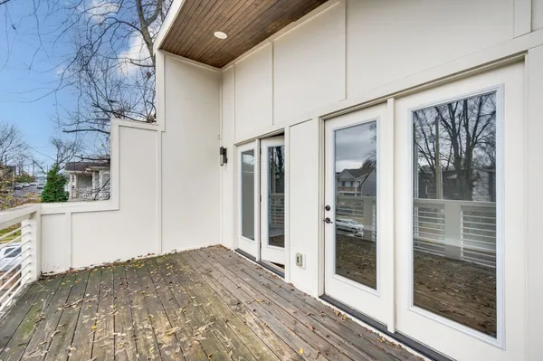 a view of backyard with wooden fence