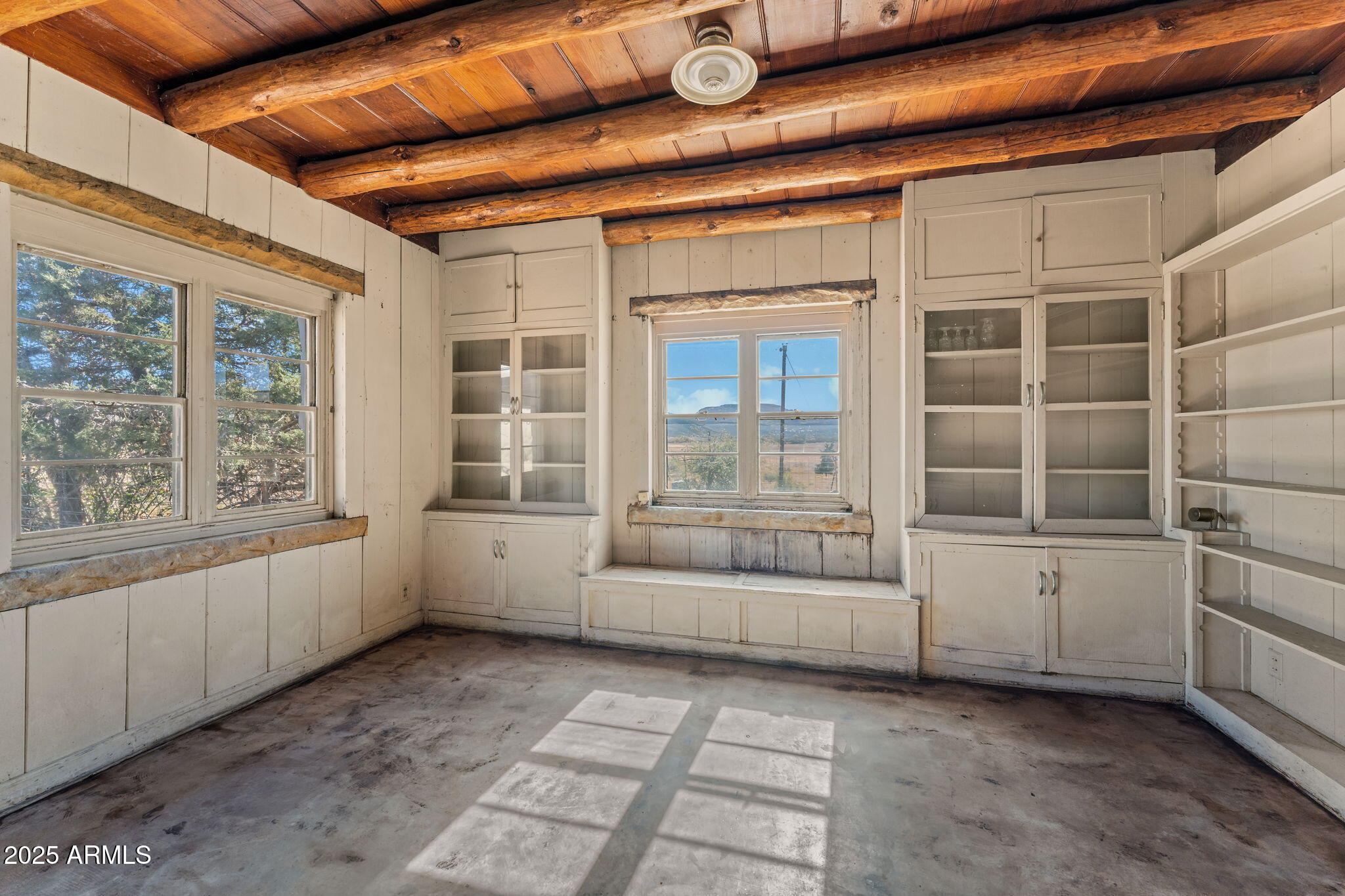 16057 Sickles Ranch Road Peeples Valley, AZ 86332 - Photo 12 of 39 a view of an empty room with a window