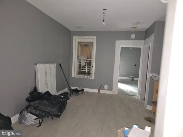 a room with a mirror and gym equipment