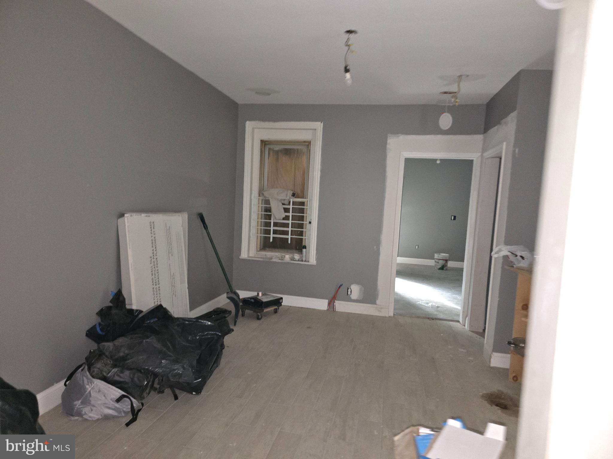 424 Highland Avenue Chester, PA 19013 - Photo 8 of 13 a room with a mirror and gym equipment