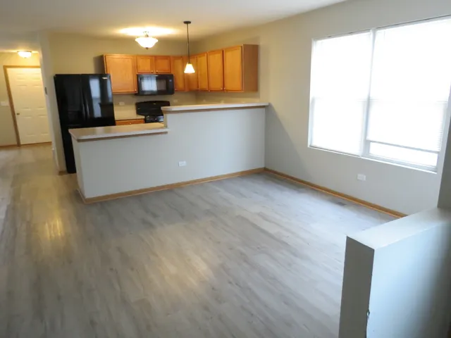 a kitchen with stainless steel appliances a refrigerator and a sink