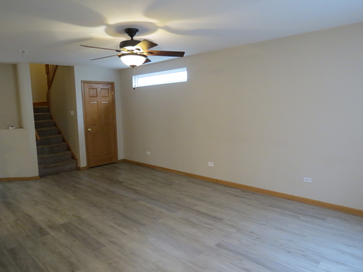 191 Mountain Laurel Court Romeoville, IL 60446 - Photo 7 of 29 wooden floor in an empty room with a window