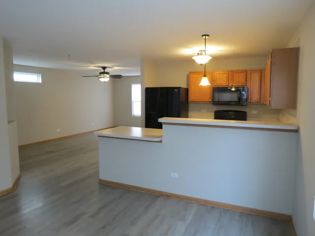 a view of a living room with wooden floor