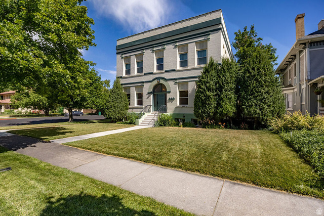 299 West Center Street, Unit 2 Logan, UT 84321 - Photo 2 of 46 Classical-style building with a light-colored facade and dark trim details