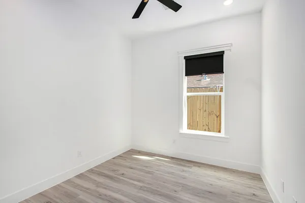 an empty room with a empty space and a window