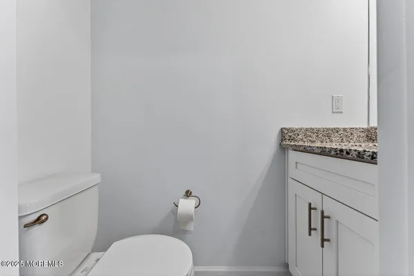 a bathroom with a toilet and a sink