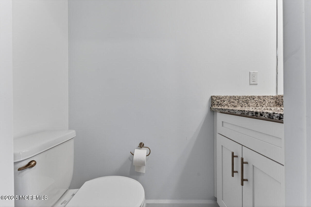 208 Prestige Road Brick, NJ 08723 - Photo 19 of 33 a bathroom with a toilet and a sink