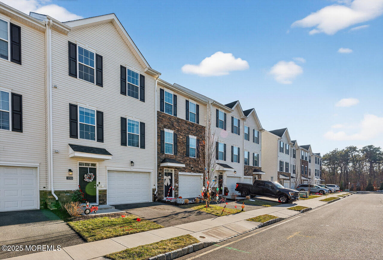 208 Prestige Road Brick, NJ 08723 - Photo 2 of 33 a view of a street with houses