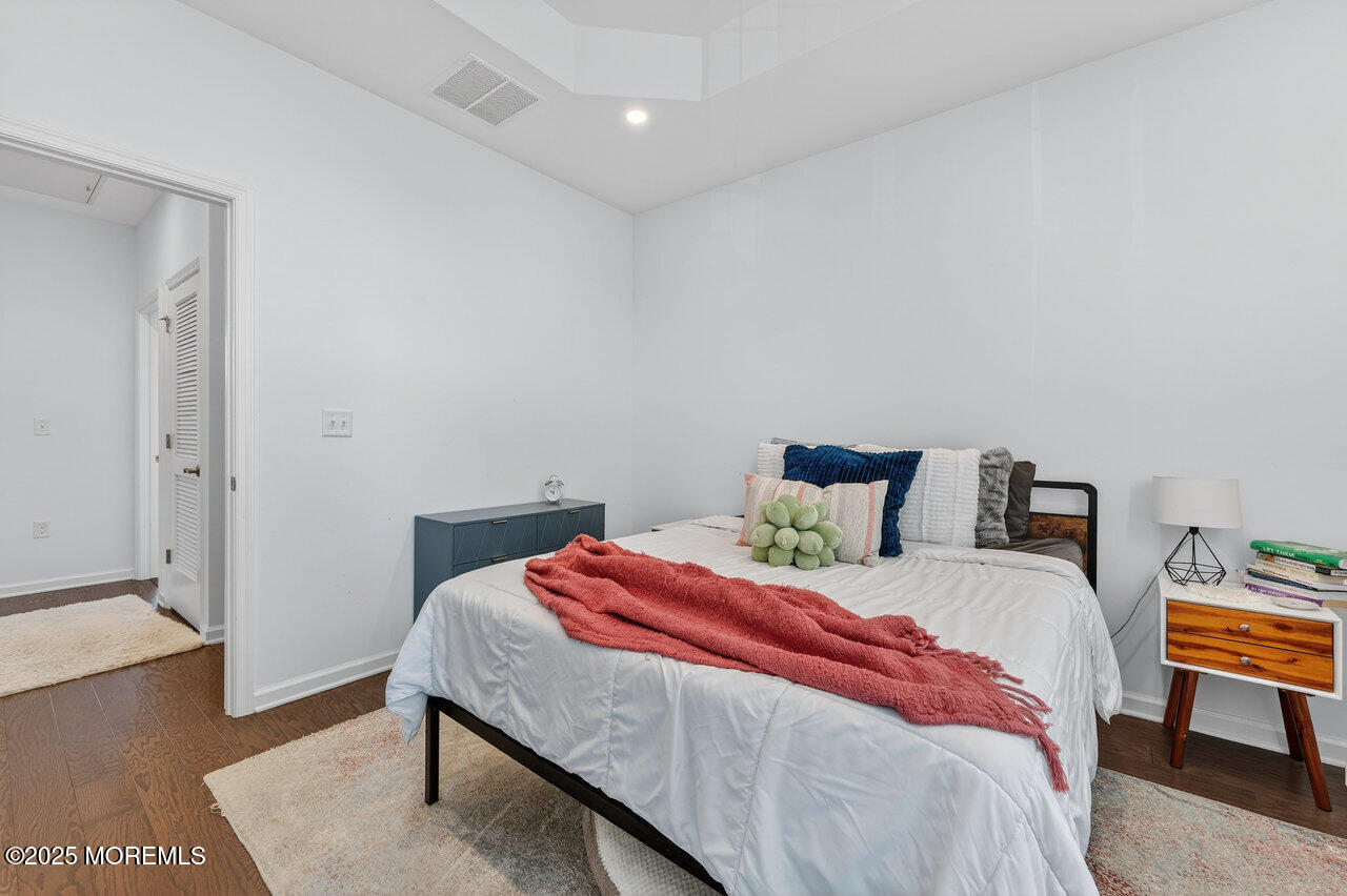 208 Prestige Road Brick, NJ 08723 - Photo 25 of 33 a bedroom with a bed and a night stand