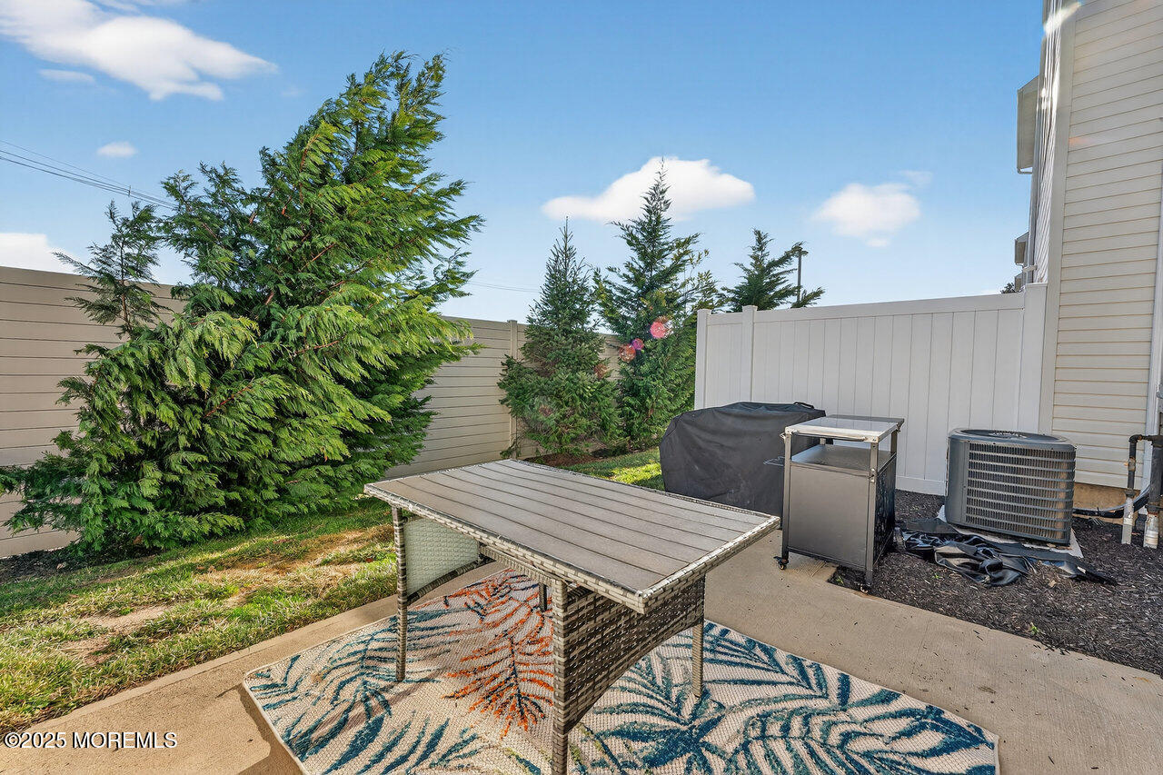 208 Prestige Road Brick, NJ 08723 - Photo 28 of 33 a view of a dinning table and chairs in patio