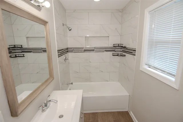 a bathroom with a bathtub and a shower