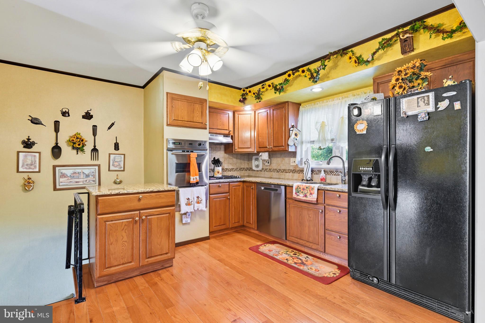 564 Byron Road Warminster, PA 18974 - Photo 13 of 49 a kitchen with stainless steel appliances granite countertop a refrigerator a stove and a sink with cabinets