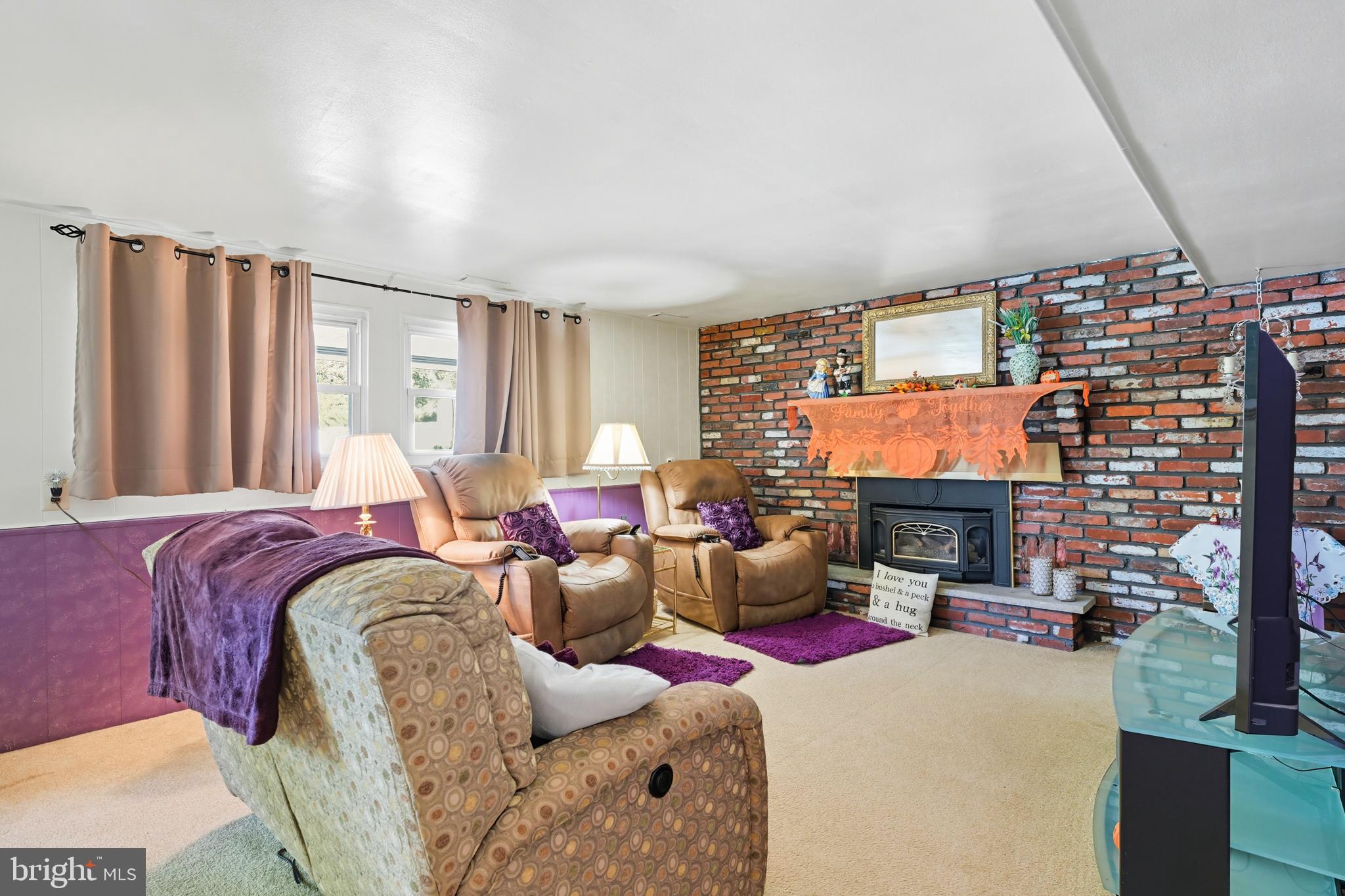 564 Byron Road Warminster, PA 18974 - Photo 25 of 49 a living room with fireplace furniture and a flat screen tv