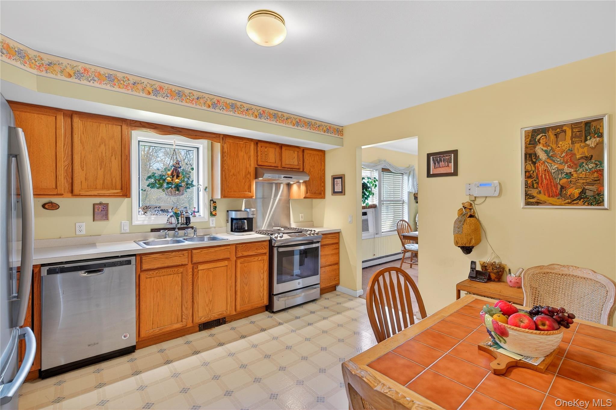 1044 Blue Mountain Road Saugerties, NY 12477 - Photo 11 of 32 a kitchen with stainless steel appliances granite countertop a sink and a refrigerator