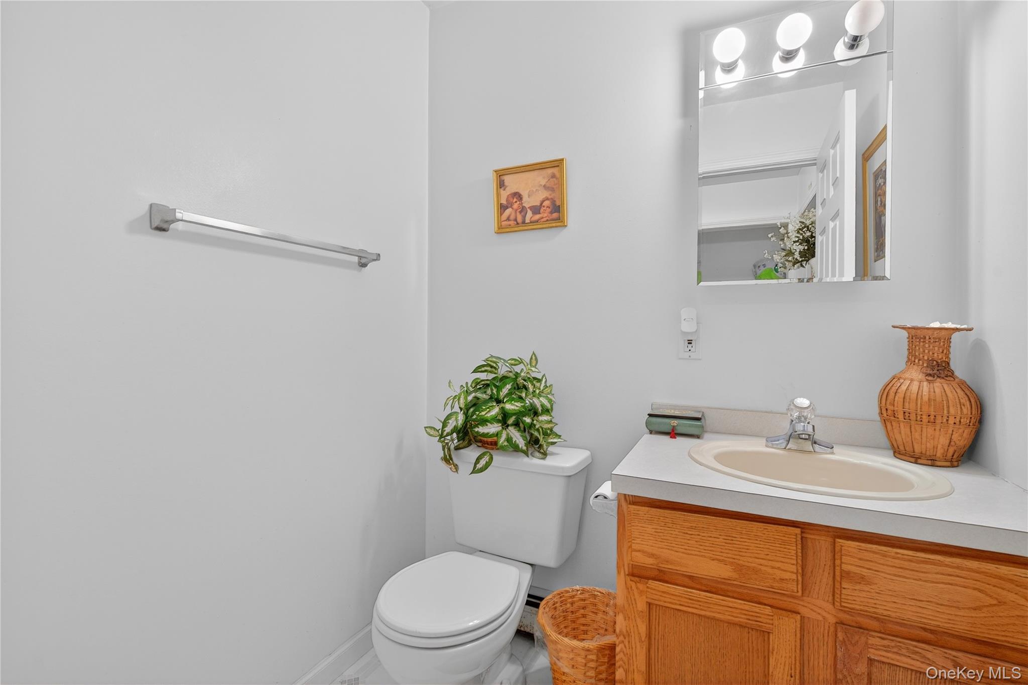 1044 Blue Mountain Road Saugerties, NY 12477 - Photo 13 of 32 a bathroom with a sink mirror vanity and toilet