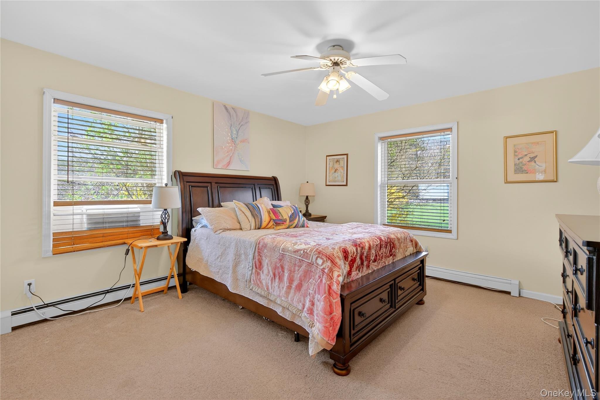 1044 Blue Mountain Road Saugerties, NY 12477 - Photo 20 of 32 a spacious bedroom with a bed and a table lamp