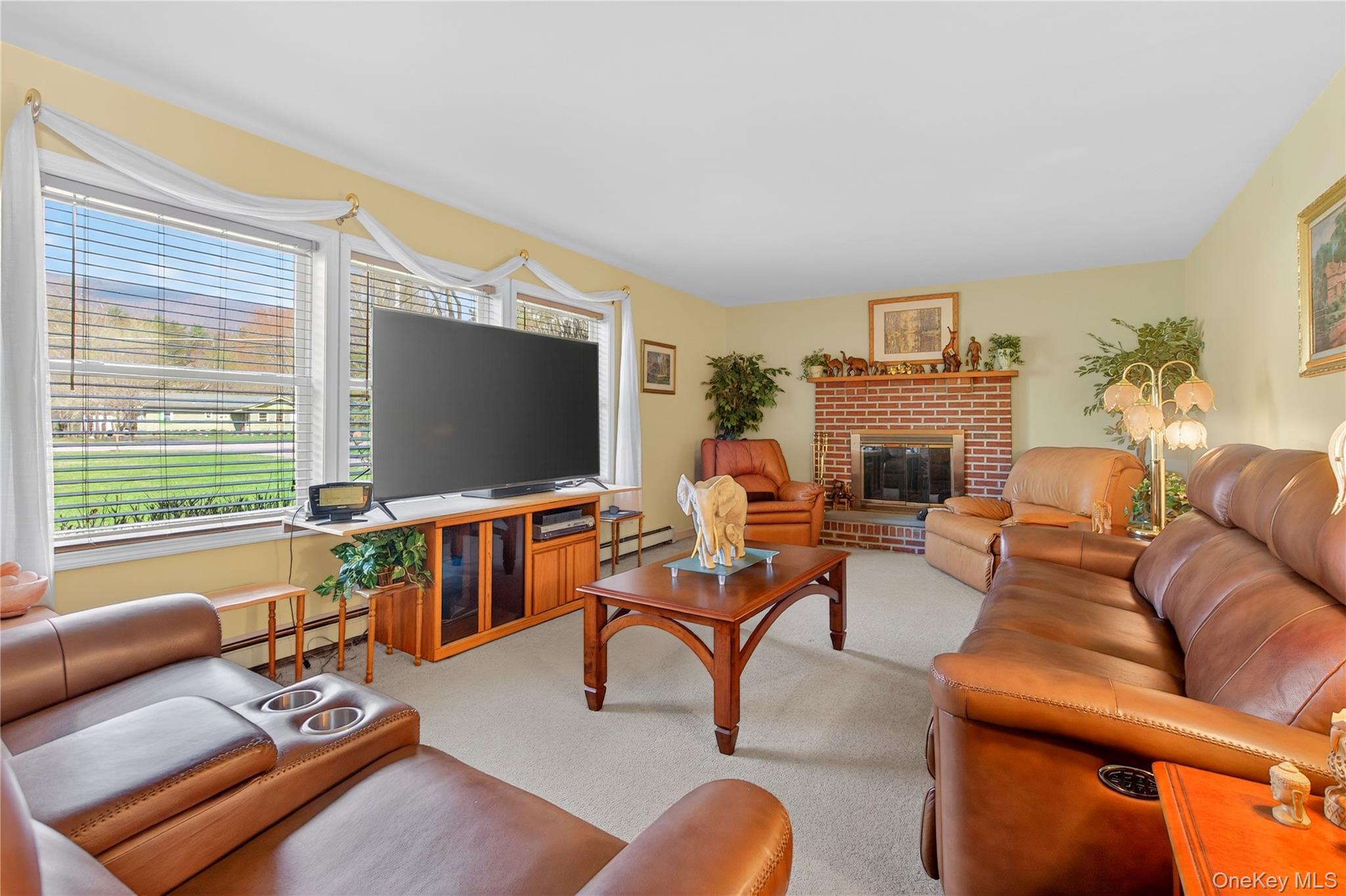 1044 Blue Mountain Road Saugerties, NY 12477 - Photo 2 of 32 a living room with furniture and a flat screen tv