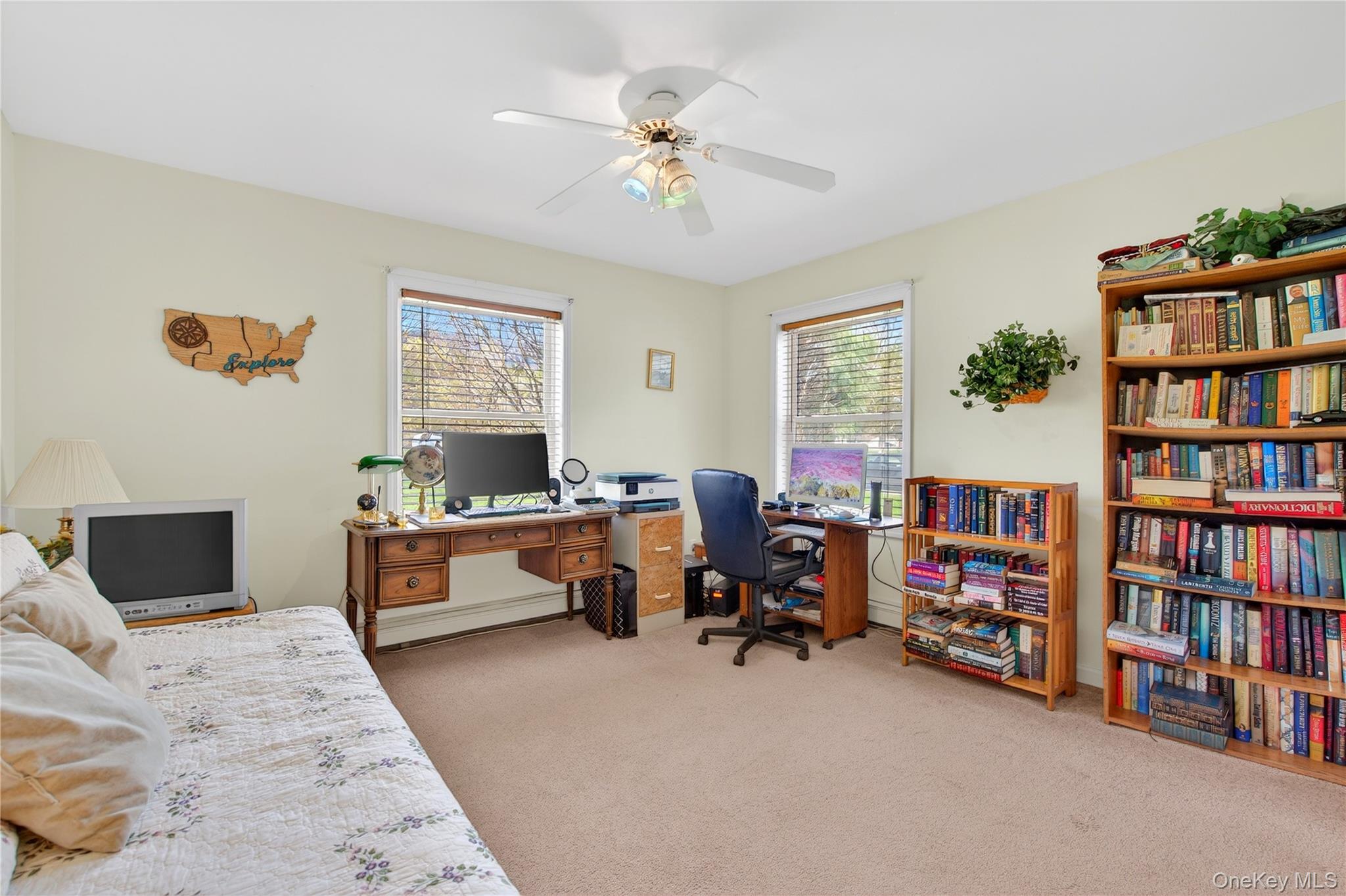 1044 Blue Mountain Road Saugerties, NY 12477 - Photo 22 of 32 a living room with furniture and a book shelf