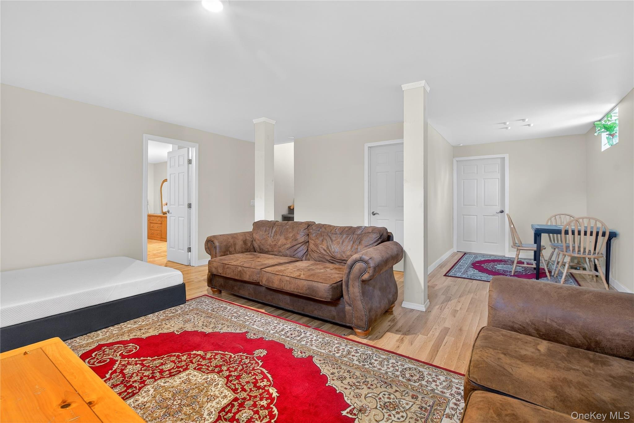 1044 Blue Mountain Road Saugerties, NY 12477 - Photo 24 of 32 a living room with furniture and a rug