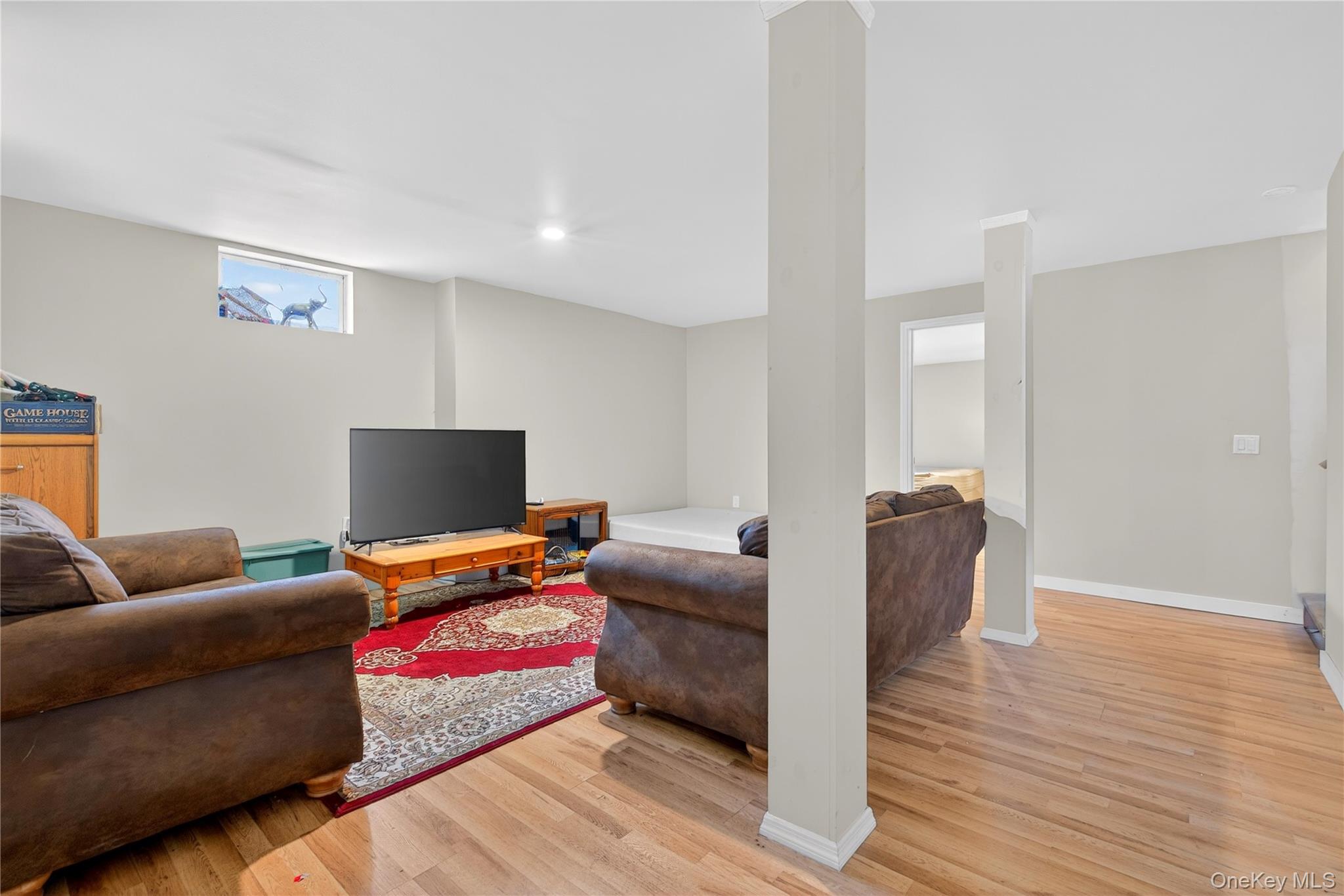 1044 Blue Mountain Road Saugerties, NY 12477 - Photo 25 of 32 a living room with furniture and a flat screen tv